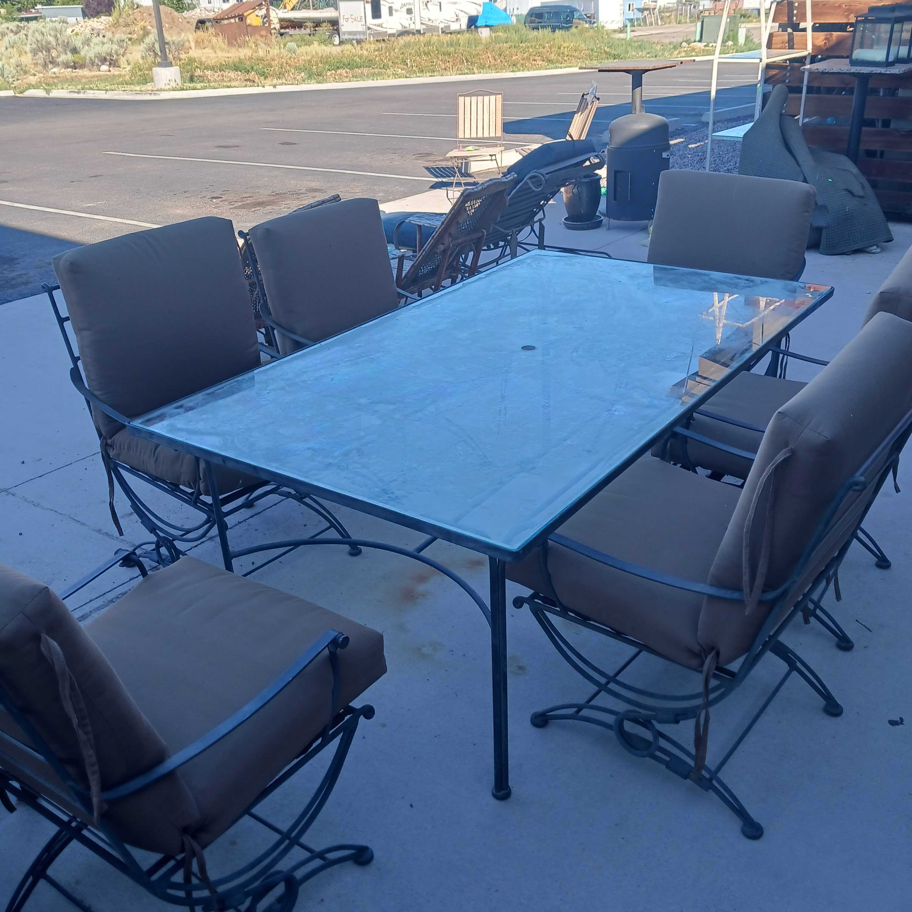 Spring Rocker Chairs with Glass Top Steel Patio Table Set