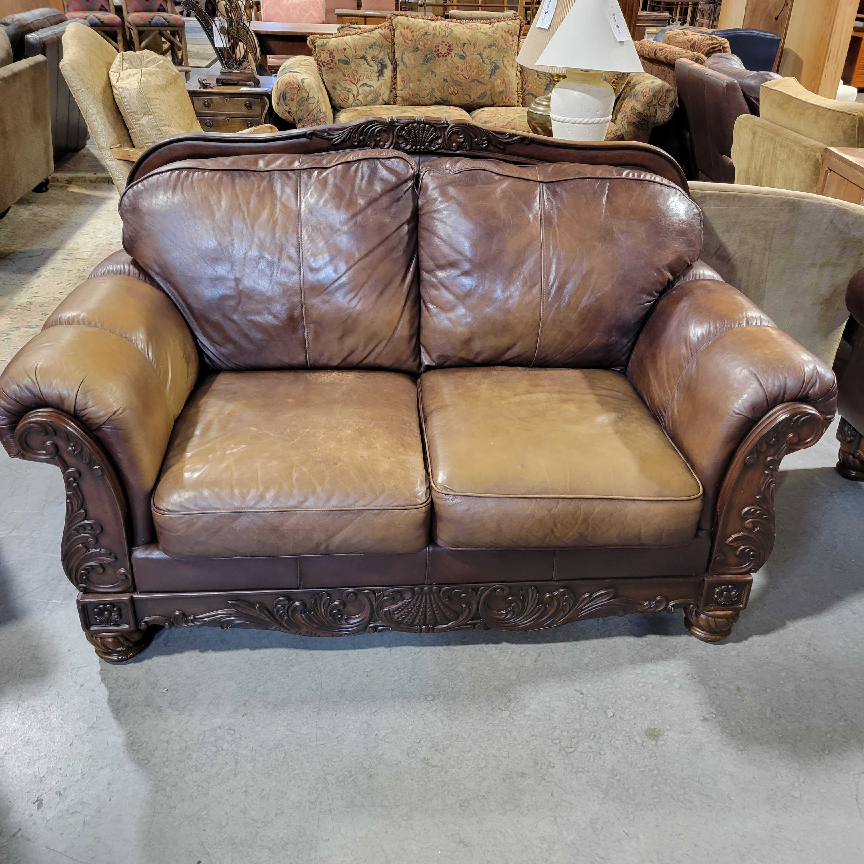 Ashley Furniture Carved Wood & Brown Leather Loveseat Sofa