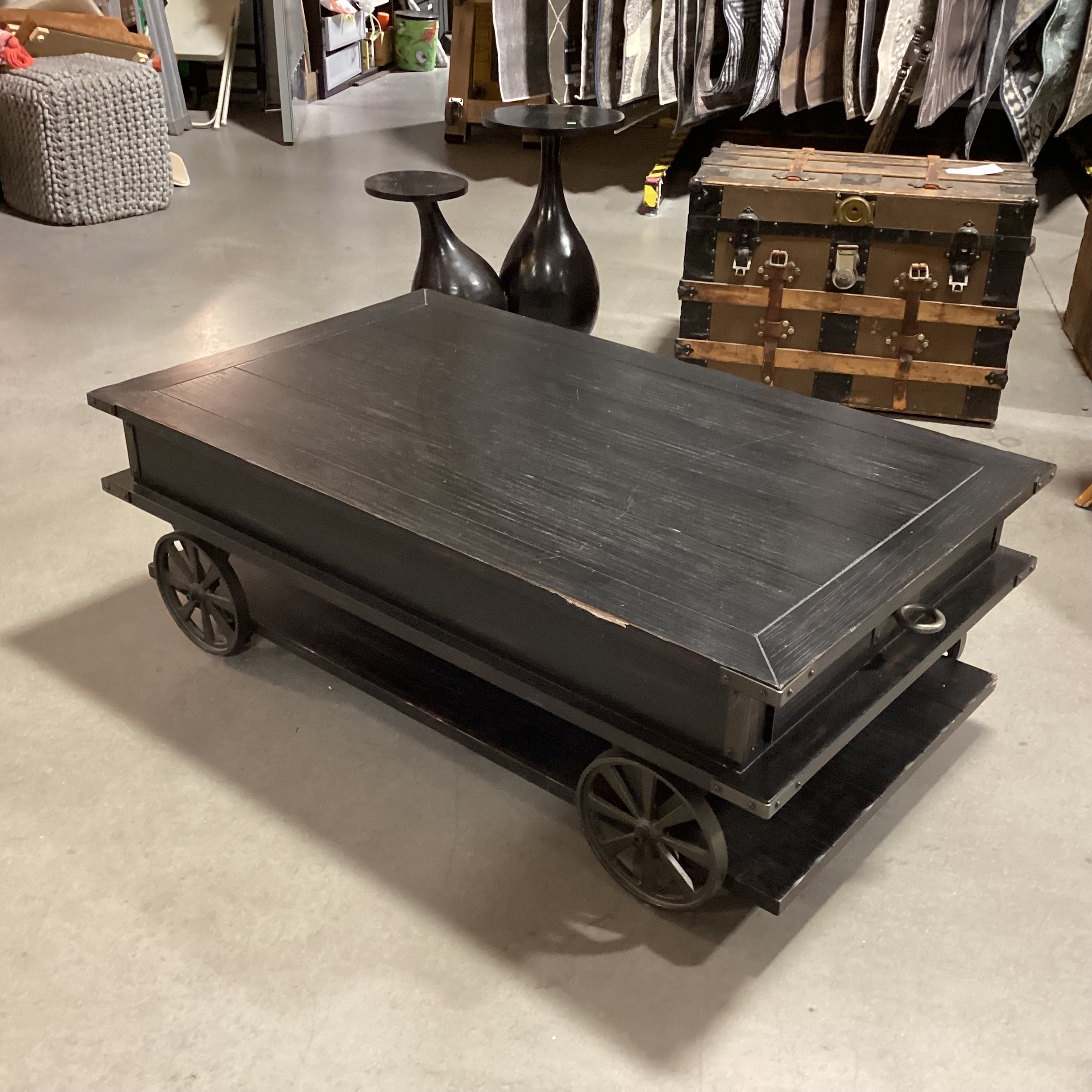 Magnussen Home Sheffield Antiqued Black Wood 2 Drawer with Wheels Cart Like Coffee Table 50"x 30"x 17.5"