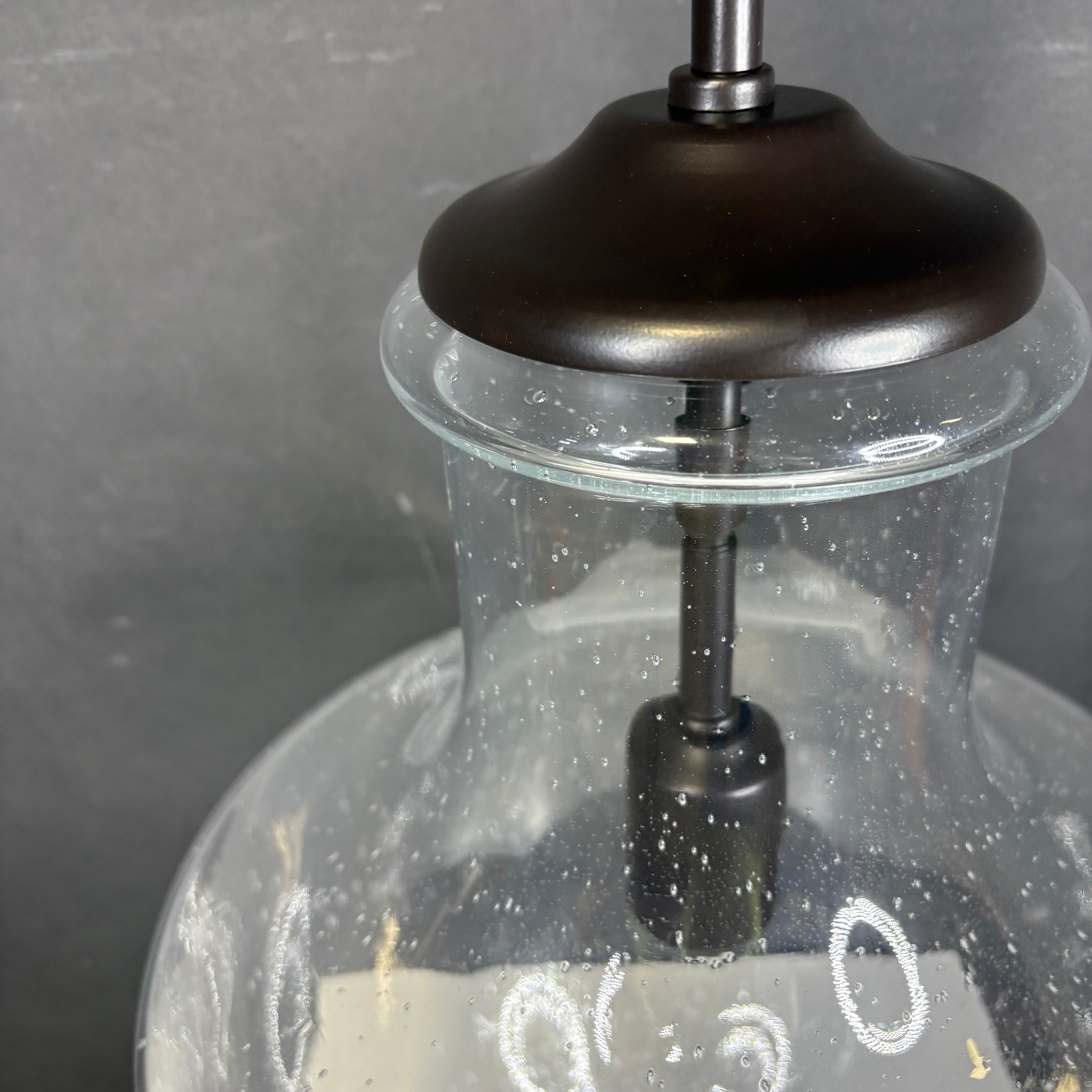 Generation Lighting Baylor 1-Light Bronze with Seeded Glass Ceiling Pendant 12” Diameter x 17” - 42”