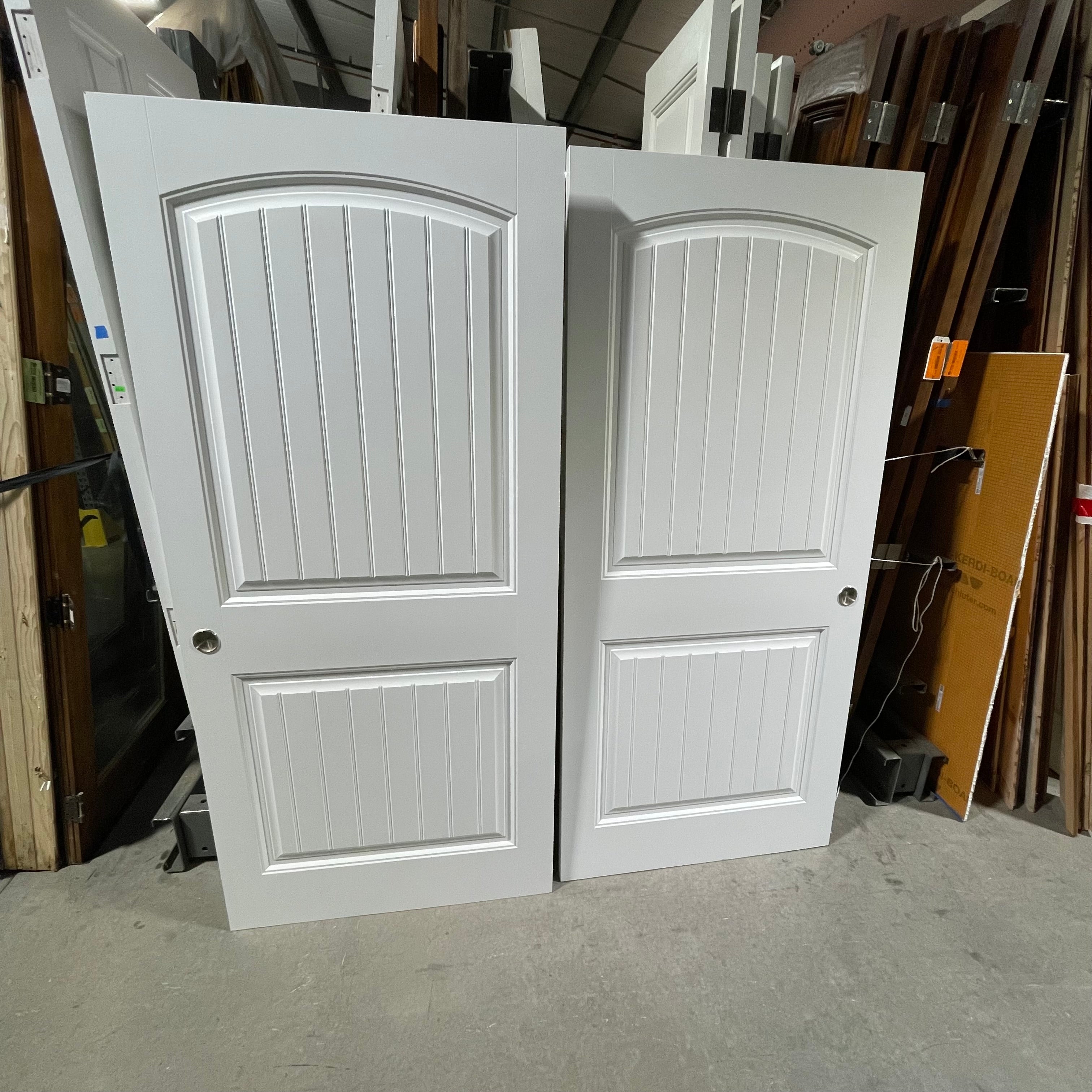 36"x 78.75"x 1.25" White 2 Panel Vertical Lined Arched Upper Panel Pair of Pocket Doors