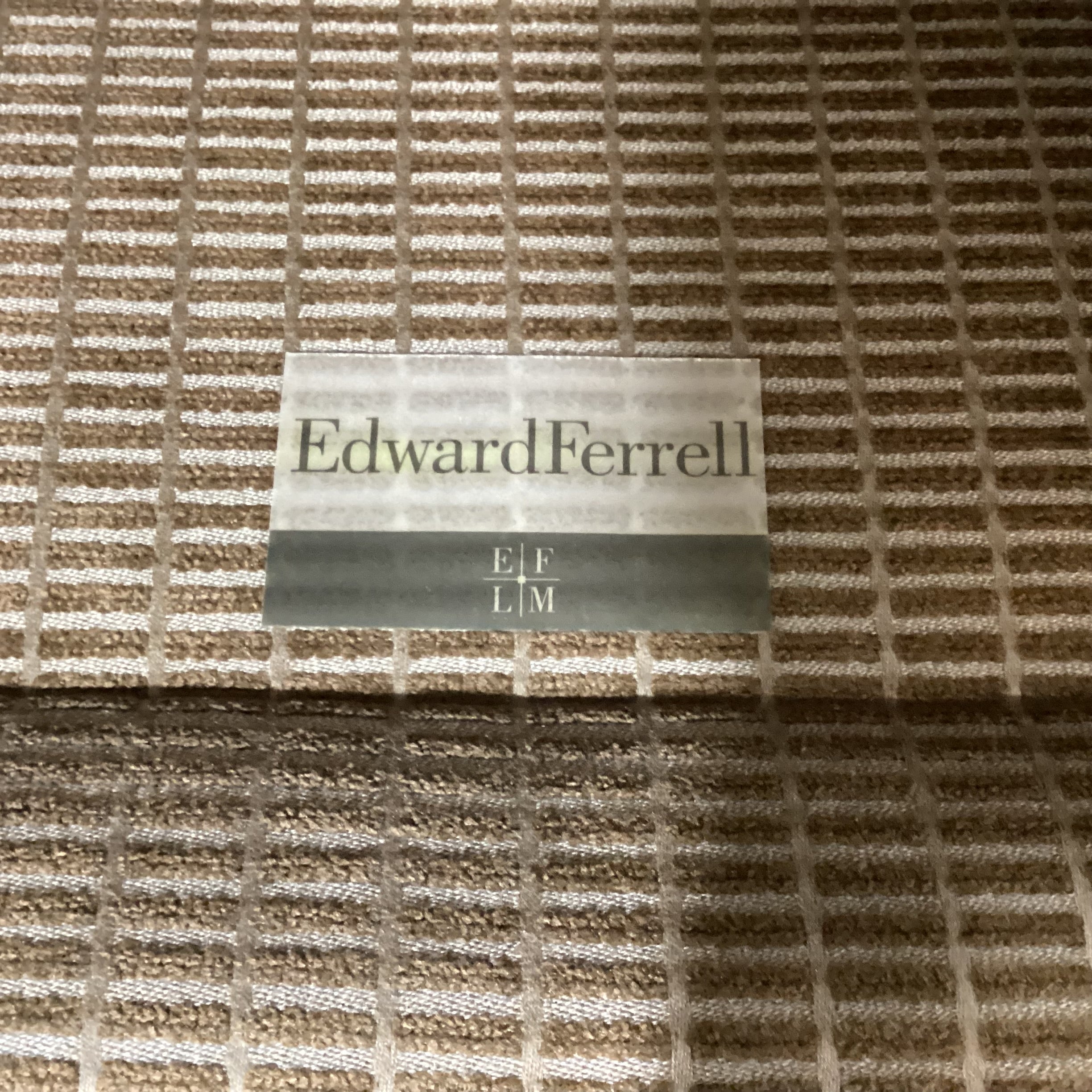 Edward Ferrell Brown & Tan Raised Woven with Carved Foot Brass Casters Chair 35"x 42"x 33"