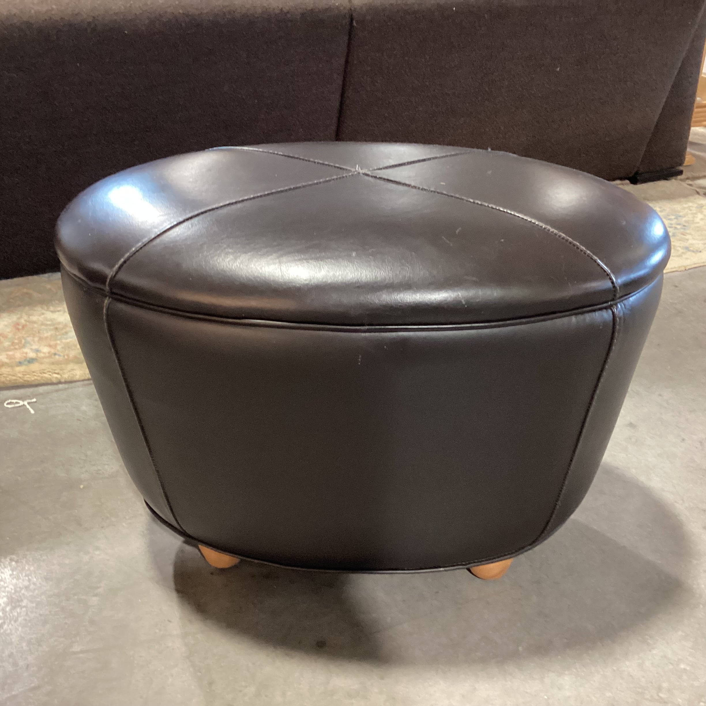 Oval Chocolate Leather & Wood Feet Ottoman 26"x 18"x 18"