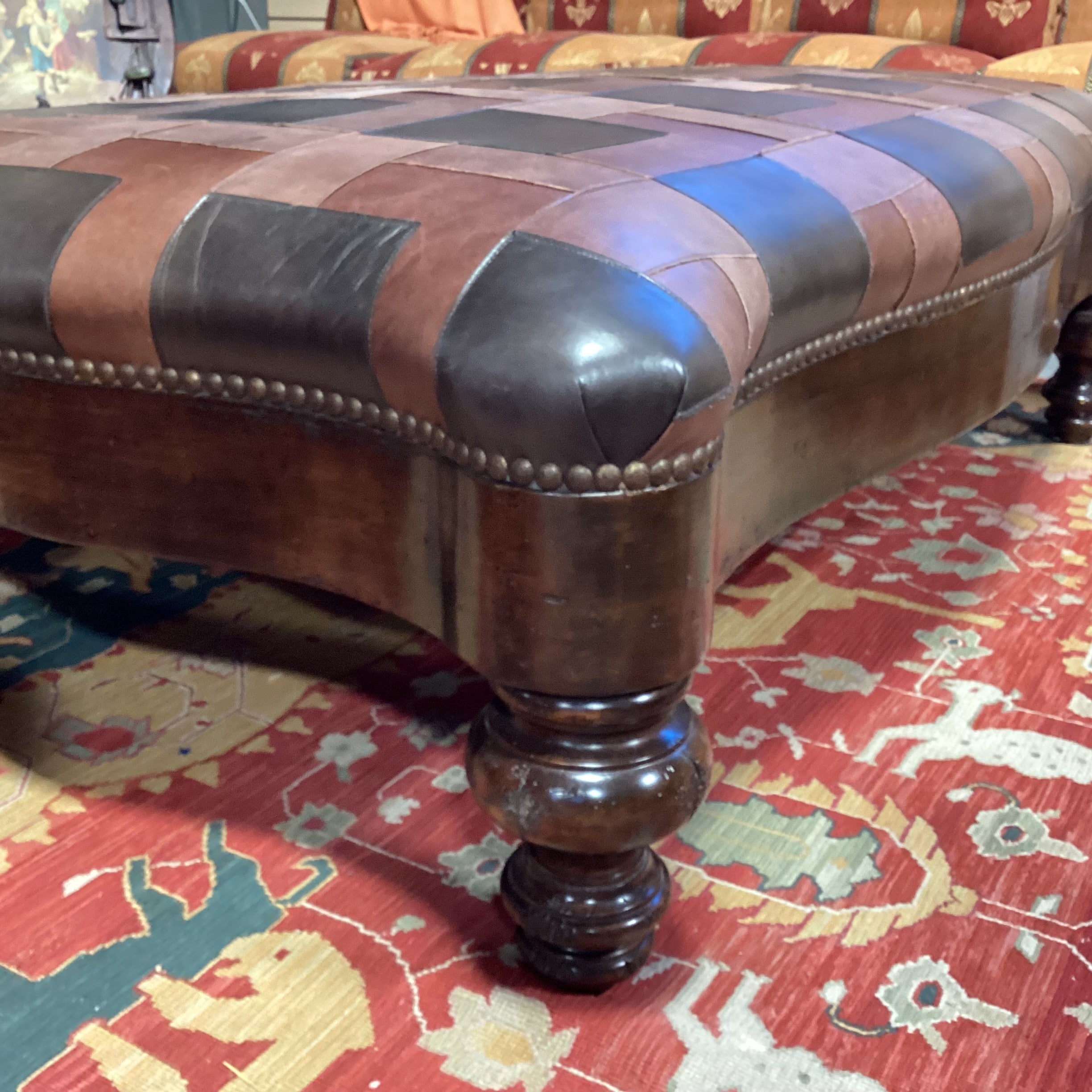 T J Hooker Brown Tones Patchwork Leather Nailhead & Carved Distressed Wood Cocktail Ottoman 61"x 41"x 20"