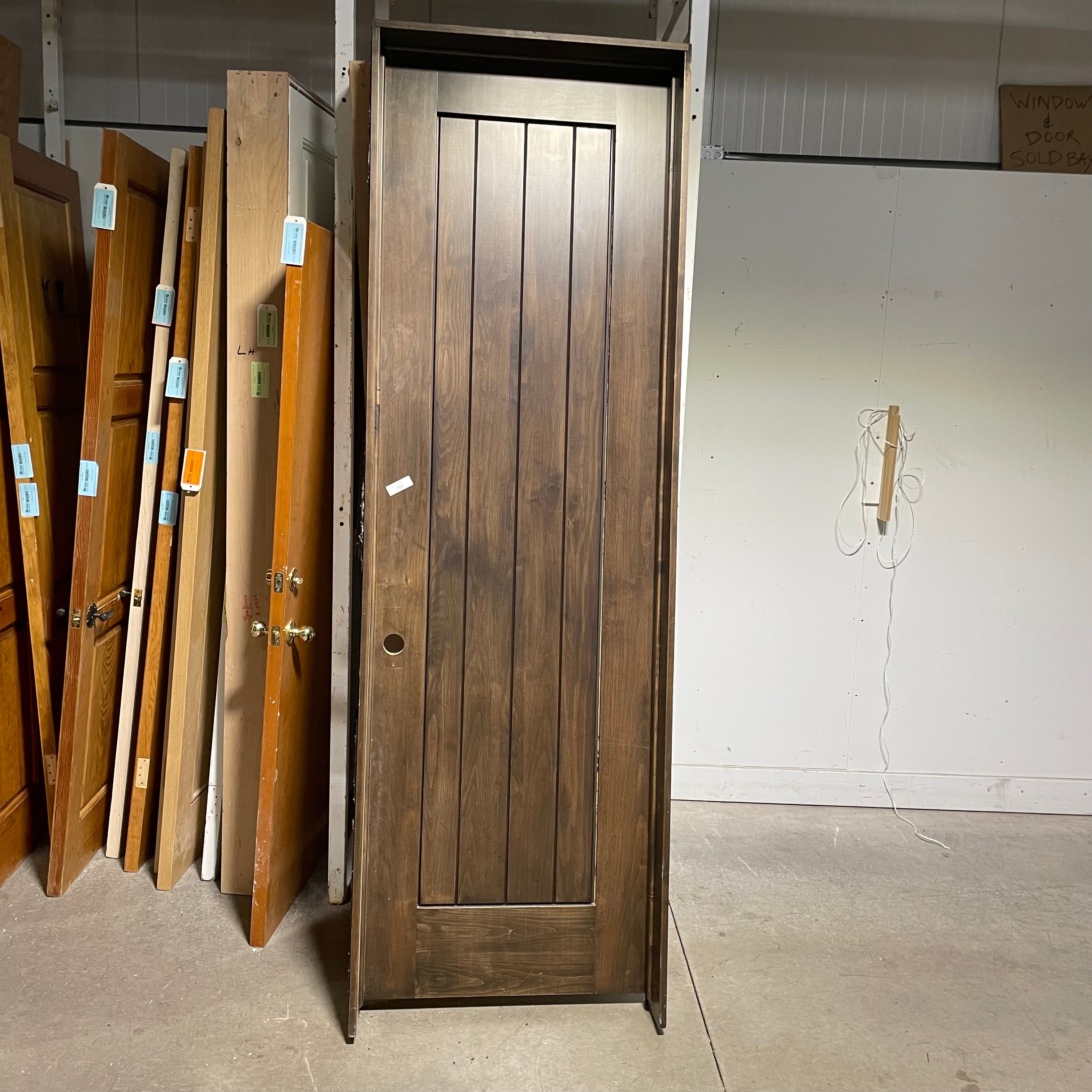 29.75"x 96"x 1.75" Rough Opening is 31.5"x 98.25"x 6.75" Brown Vertical Lined Walnut Interior Door with Jamb