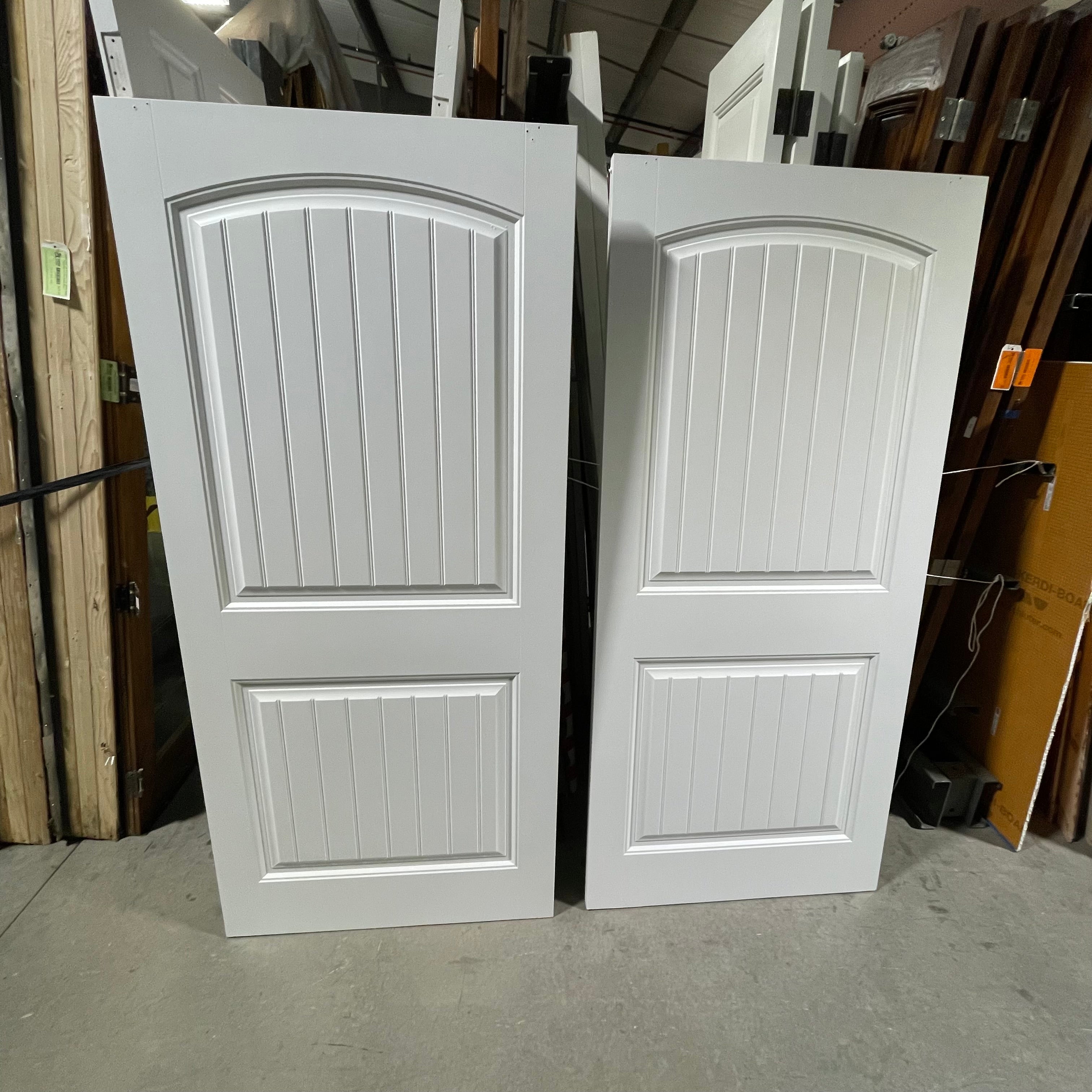 36"x 78.75"x 1.25" White 2 Panel Vertical Lined Arched Upper Panel Pair of Pocket Doors