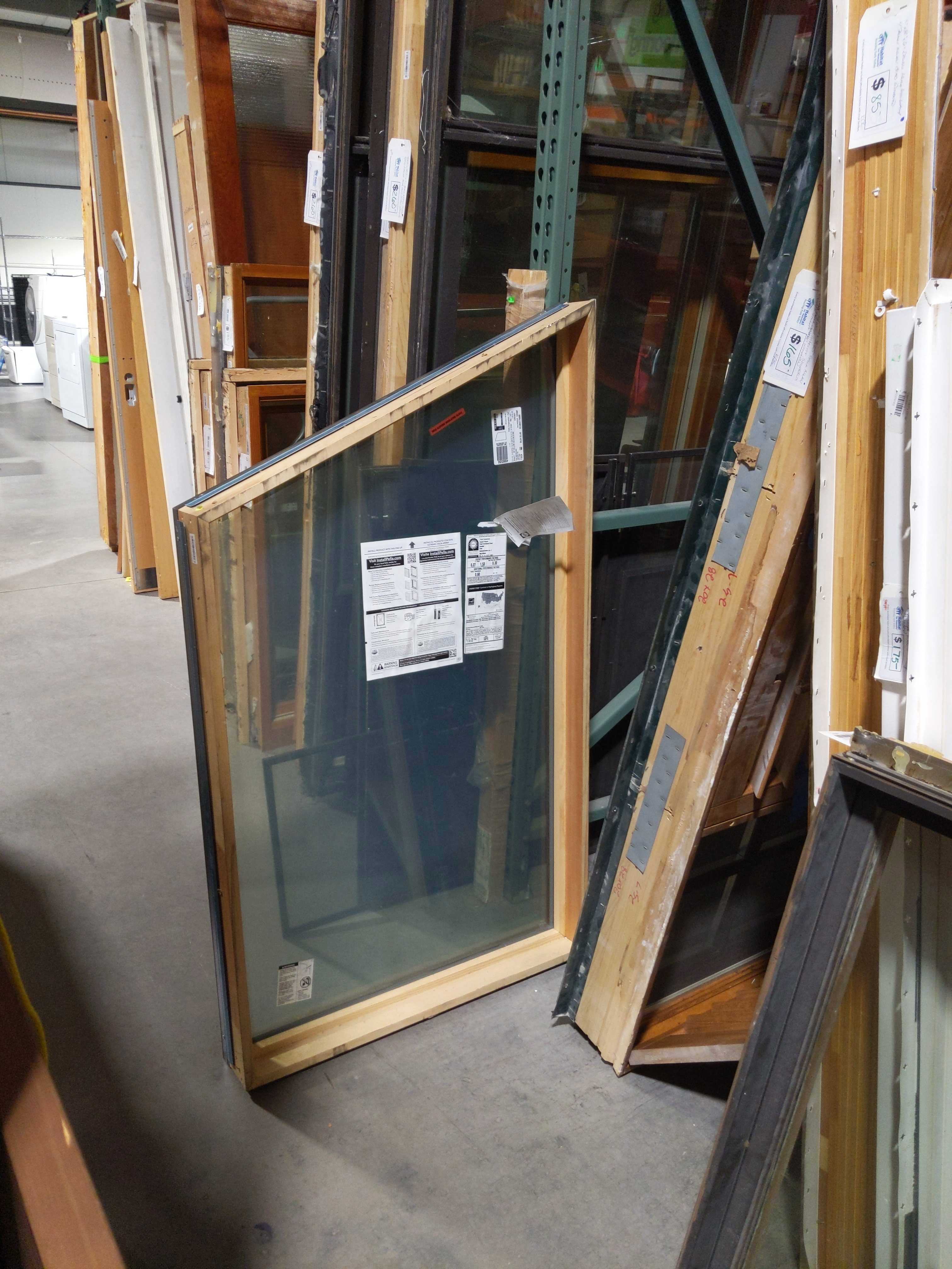 44" to 58"x 33.75"x 5" Black Metal Clad Wood Interior Pella Fixed Angled Window